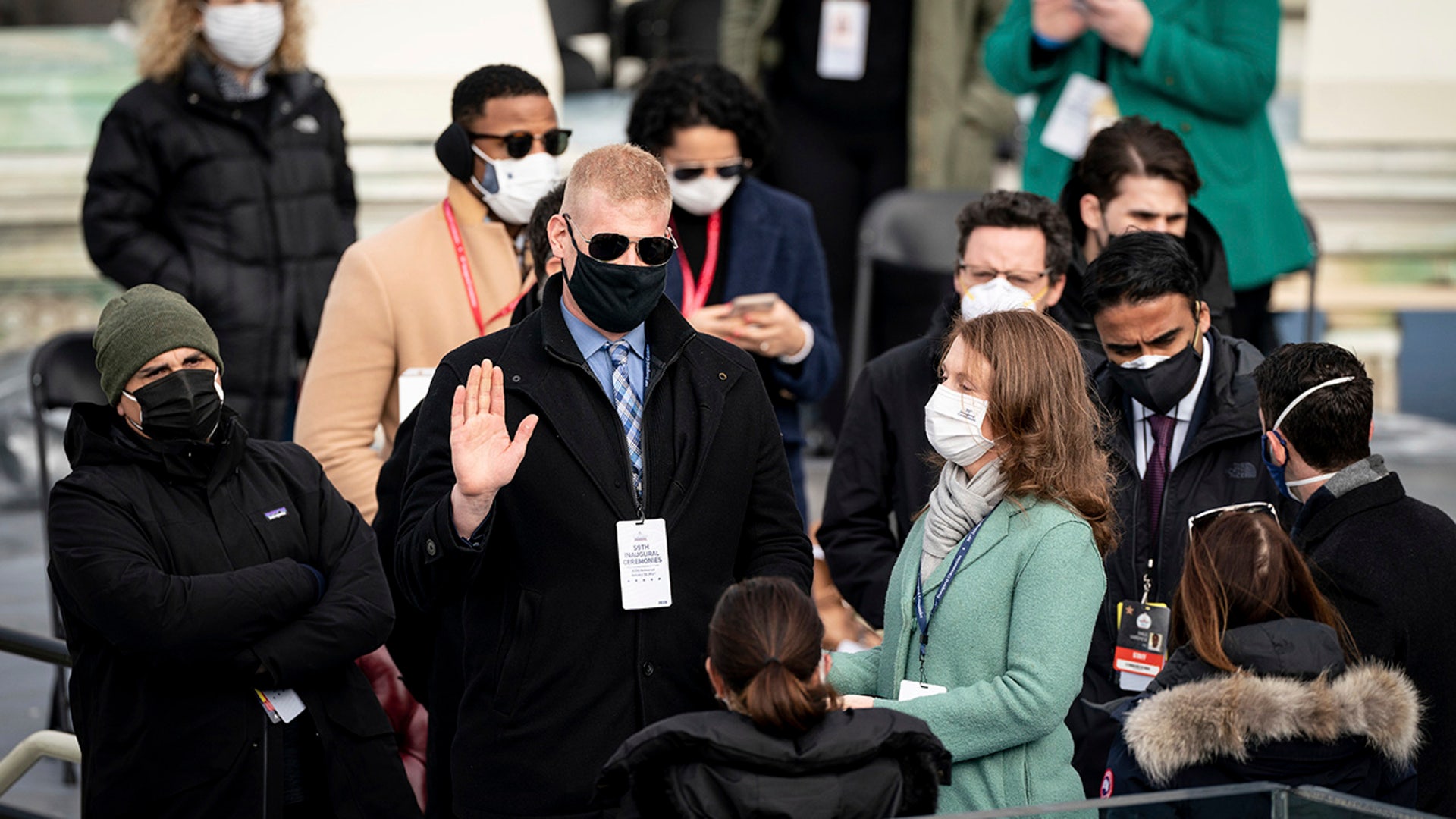 A stand-in for President-elect Joe Biden is sworn in on the podium, as a stand-in for Jill Biden looks on, during a rehearsal for the 59th presidential inauguration at the U.S. Capitol in Washington, Monday, Jan. 18, 2021.