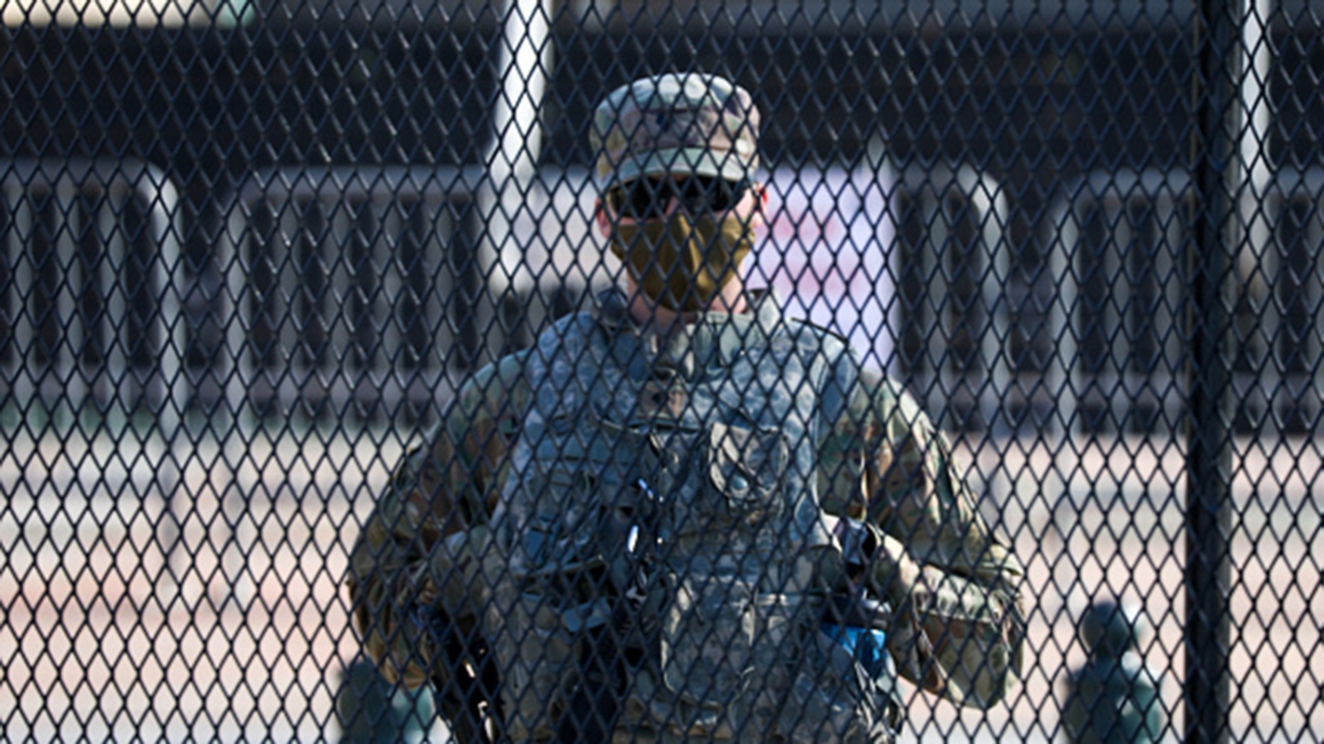 Members of the National Guard are issued weapons outside of the U.S. Capitol in Washington, D.C., on Wednesday, Jan. 13, 2021. (Yasin Ozturk/Anadolu Agency via Getty Images)