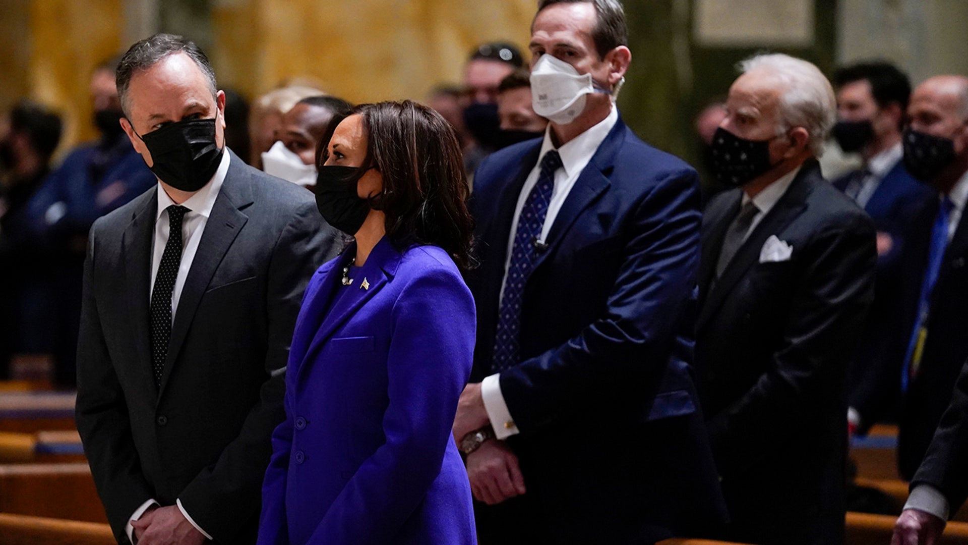 Vice President-elect Kamala Harris and her husband Doug Emhoff attend Mass at the Cathedral of St. Matthew the Apostle during Inauguration Day ceremonies Wednesday, Jan. 20, 2021, in Washington. (AP Photo/Evan Vucci)