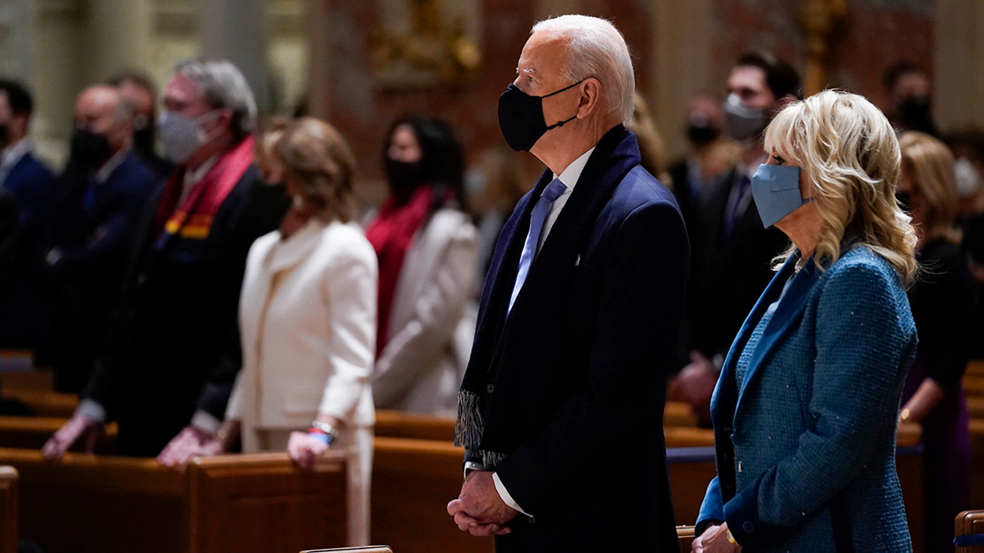 President-elect Joe Biden and his wife Jill Biden attend Mass at the Cathedral of St. Matthew the Apostle during Inauguration Day ceremonies Wednesday, Jan. 20, 2021, in Washington. (AP Photo/Evan Vucci)
