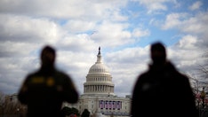 Heavily fortified statehouses around US see small protests