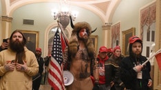 QAnon: What to know about the fringe conspiracy theory and its influence