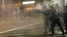 Portland's police riot squad resigns after officer indicted over alleged assault on photographer