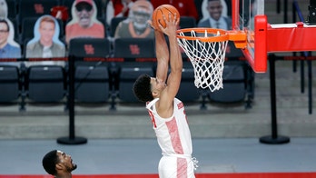 No. 11 Houston uses big first half to cruise past UCF 75-58