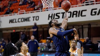 Culver leads No. 14 West Virginia from 19 down past Oklahoma State