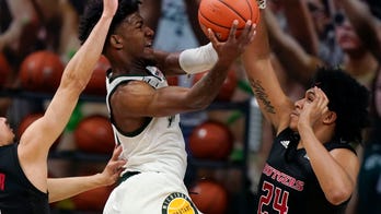 Henry scores 20, No. 23 Michigan State beats No. 15 Rutgers