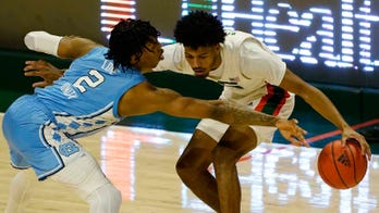 Platek's runner sends Tar Heels past Miami 67-65
