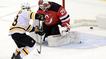 Bruins win 3-2 in SO, spoil Ruff's debut as Devils coach