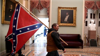 Capitol rioter carrying Confederate flag wanted by FBI: ‘Seeking the public’s assistance’