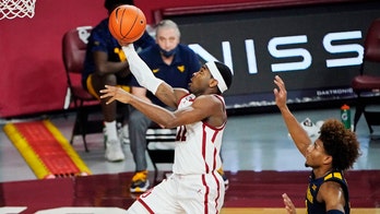 Gibson hits 8 3s, Oklahoma beats No. 9 West Virginia 75-71