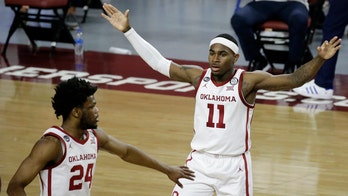 Harmon's 22 points sends Oklahoma past No. 9 Kansas 75-68