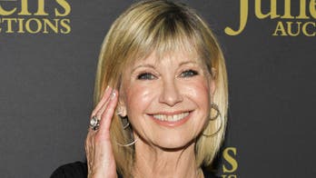 ‘Grease’ star Olivia Newton-John details first kiss with John Travolta: ‘It was a beautiful day’
