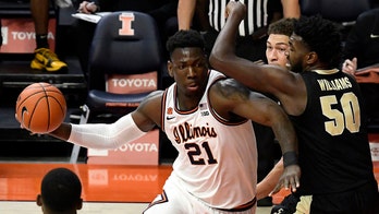 Cockburn and Dosunmu lead No. 15 Illinois past Purdue 66-58