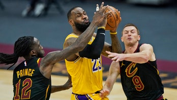 NBA fan's 'LeBron James is a racist' shirt, incident with security leads to removal during game: report