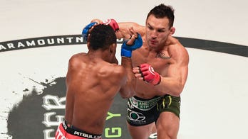 Michael Chandler stuns Dan Hooker with first-round TKO at UFC 257