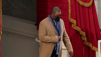 Capitol Police Officer Eugene Goodman, hero during riots, escorts Kamala Harris during inauguration