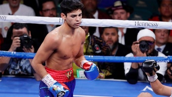 Young rising star Garcia stops Campbell in 7th round