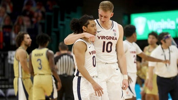 Hauser, Clark lift No. 13 Virginia past Georgia Tech, 64-62