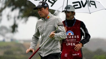 Viktor Hovland vaults into Farmers lead at wet Torrey Pines