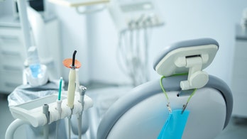 Dentist in Florida fired after caught on camera ripping down posters of kidnapped Israeli children