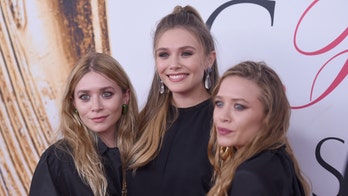 Elizabeth Olsen says growing up with famous sisters was a 'unique' experience