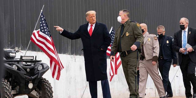 President Donald Trump tours a section of the U.S.-Mexico border wall, Tuesday, Jan. 12, 2021, in Alamo, Texas. (Associated Press)