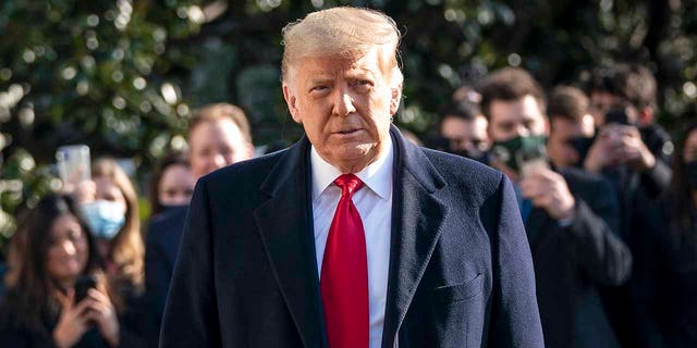 President Donald Trump turns to reporters as he exits the White House to walk toward Marine One on the South Lawn on Jan. 12, 2021, in Washington, D.C. (Drew Angerer/Getty Images)