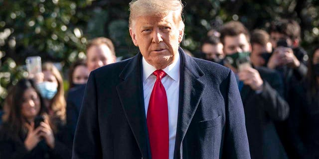 WASHINGTON, DC - JANUARY 12: US President Donald Trump looks to reporters as he leaves the White House to walk towards Marine One on the South Lawn on January 12, 2021 in Washington, DC.  In the wake of last week's deadly pro-Trump riot on Capitol Hill, President Trump makes his first public appearance with a trip to the border town of Alamo, Texas, to see partial construction of the wall along from the US-Mexico border.  (Photo by Drew Angerer / Getty Images)