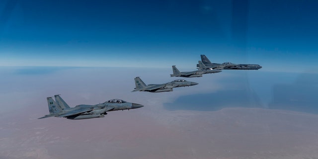 A U.S. Air Force B-52 Stratofortress from the 2nd Bomb Wing, Barksdale Air Force Base, LA, flew with Royal Saudi Arabian Air Force F-15SAs during a bomber task force mission over the U.S. Central Command area of responsibility, Jan. 27, 2021. (U.S. Air Force photo by Senior Airman Roslyn Ward)