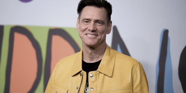 In recent weeks, actor and comedian Jim Carrey has shared political cartoons on Twitter.  (Richard Shotwell / Invision / AP)