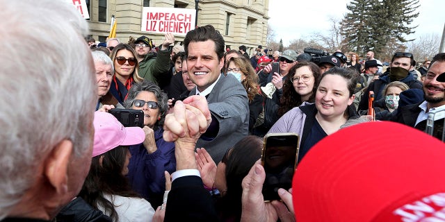 U.S. Rep. Matt Gaetz, R-Fla., grabs the hand of a supporter following a rally against U.S. Rep. Liz Cheney, R-Wyo., Thursday, Jan. 28, 2021, outside the Wyoming State Capitol in Cheyenne. (Associated Press)