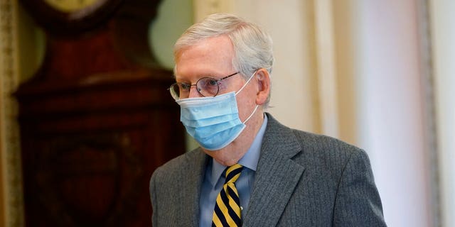 In this Dec. 30, 2020, file photo Senate Majority Leader Mitch McConnell of Ky., walks to the Senate floor on Capitol Hill in Washington. McConnell will be under a microscope if the House impeaches President Trump Wednesday. (AP Photo/Susan Walsh)
