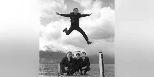 Gerry Marsden leaps over his band, the Pacemakers.