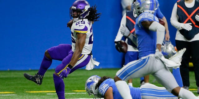 Minnesota Vikings running back Alexander Mattison (25) breaks away from Detroit Lions outside linebacker Jahlani Tavai for a touchdown during the first half of an NFL football game, Sunday, Jan. 3, 2021, in Detroit. (AP Photo/Duane Burleson)