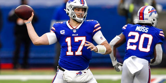Buffalo Bills quarterback Josh Allen passes in the first half of an NFL football game against the Miami Dolphins, Jan. 3, in Orchard Park, N.Y. (AP Photo/Adrian Kraus)