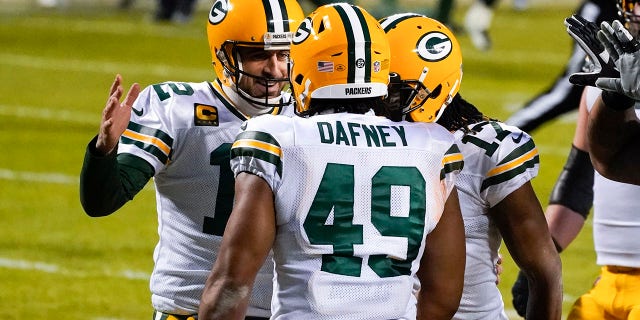Green Bay Packers' Dominique Dafney is congratulated by quarterback Aaron Rodgers after catching a touchdown pass during the first half of an NFL football game against the Chicago Bears Sunday, Jan. 3, 2021, in Chicago. (AP Photo/Nam Y. Huh)
