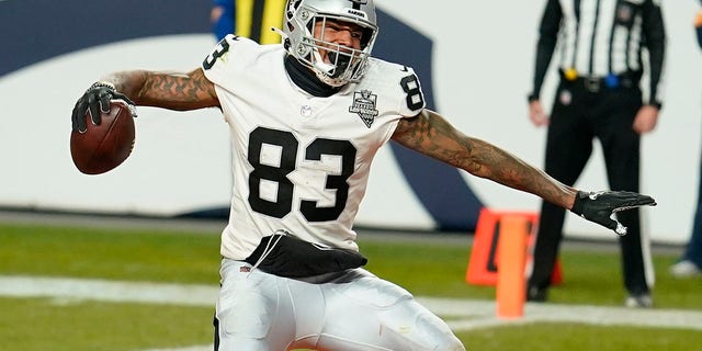 Las Vegas Raiders tight end Darren Waller celebrates after scoring a 2-point conversion against the Denver Broncos during the second half of an NFL game in Denver on January 3, 2021.