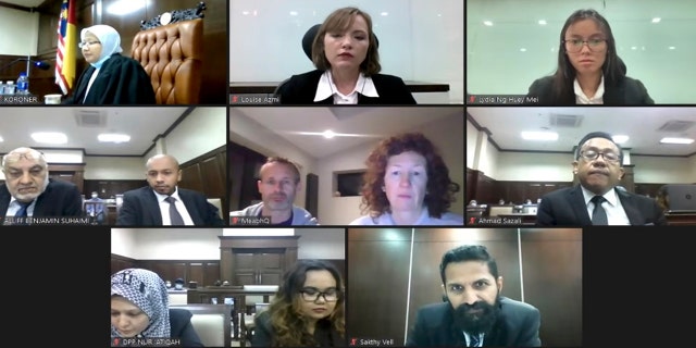 In this image from video released by Malaysian Judiciary, Meabh Quoirin and Sebastian Quoirin, center frame, mother and father of missing schoolgirl Nora Anne Quoirin, attend the verdict for inquest into the death of the Irish-French teenager, Monday, Jan. 4, 2021. A Malaysian coroner ruled Monday, Jan. 4, 2021, the death of the teen, whose body was found near a Malaysian jungle resort where she vanished while on holiday, was most likely a misadventure that didn't involve other people. (Malaysian Judiciary via AP)