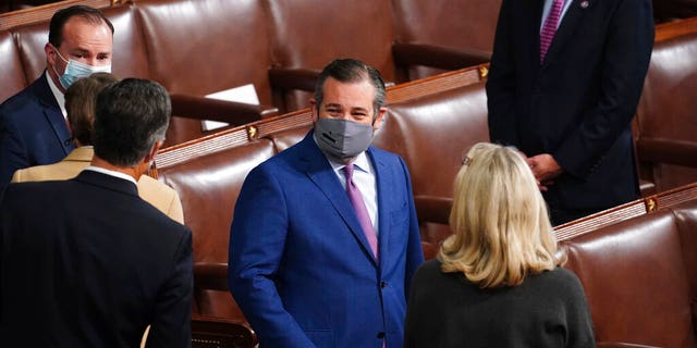 Sen. Ted Cruz, R-Texas, arrives as a joint session of the House and Senate convenes to confirm the Electoral College votes cast in November's election, at the Capitol in Washington, Wednesday, Jan. 6, 2021. (Kevin Dietsch/Pool via AP)