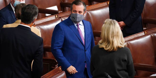 Sen. Ted Cruz, R-Texas, arrives as a joint session of the House and Senate convenes to confirm the Electoral College votes cast in November's election, at the Capitol in Washington, Wednesday, Jan. 6, 2021. (Kevin Dietsch/Pool via AP)