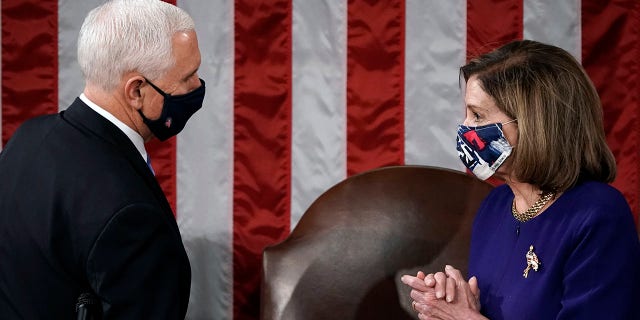 Speaker of the House Nancy Pelosi, D-Calif., And Vice President Mike Pence meet before a joint session of the House and Senate to confirm the electoral college votes cast in the November election, on Capitol Hill in Washington , Wednesday January 6, 2021 (Associated Press)