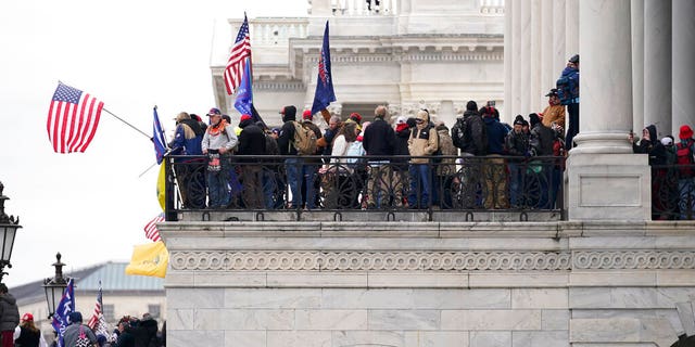 Trump supporters gather outside the Capitol, Wednesday, Jan. 6, 2021, in Washington. As Congress prepares to affirm President-elect Joe Biden's victory, thousands of people have gathered to show their support for President Trump and his claims of election fraud. (AP Photo/Manuel Balce Ceneta)