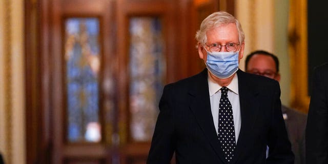 Senate Minority Leader Mitch McConnell of Ky., walks from the Senate floor to his office on Capitol Hill Wednesday, Jan. 6, 2021, in Washington. (AP Photo/Manuel Balce Ceneta)