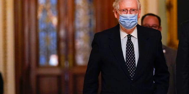 Senate Majority Leader Mitch McConnell of Ky., walks from the Senate floor to his office on Capitol Hill Wednesday, Jan. 6, 2021, in Washington. (AP Photo/Manuel Balce Ceneta)