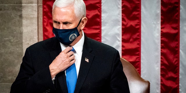 Vice President Mike Pence officiates as a joint session of the House and Senate reconvenes to confirm the Electoral College votes at the Capitol, Wednesday, Jan 6, 2021. (Erin Schaff/The New York Times via AP, Pool)