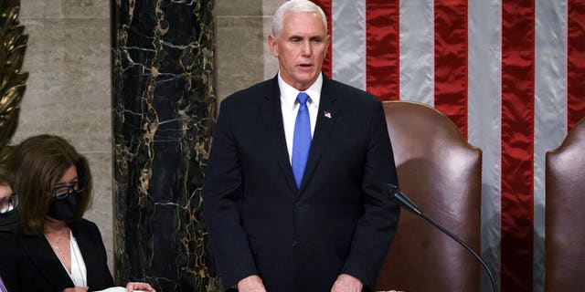 Vice President Mike Pence listens after reading the final certification of the electoral college votes cast in the November presidential election at a joint session of Congress after working all night on the Capitol in Washington, Jan. 7 . 