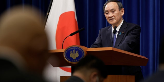 Japan's Prime Minister Yoshihide Suga speaks during a news conference at the prime minister's official residence in Tokyo, Thursday, Jan. 7, 2021. (Kiyoshi Ota/Pool Photo via AP)