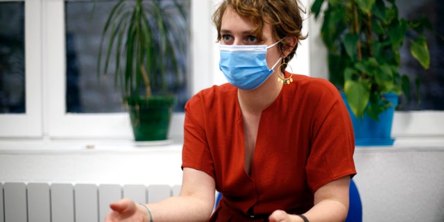 A care home director, Eve Guillaume, gestures during an interview in Paris, Wednesday, Jan. 7, 2021. (Associated Press)