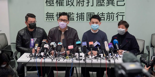 Former Democratic Party legislators Andrew Wan, left, Lam Cheuk-ting, second left, and Helena Wong, right, attend a press conference after being released on bail in Hong Kong, Friday, Jan. 8, 2021.  (AP Photo/Kin Cheung)