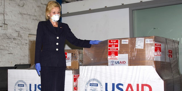 U.S. Ambassador to South Africa Lana Marks posing with ventilators donated by the U.S. Government at OR Tambo Airport Johannesburg on May 11, 2020. Marks, on Monday, Jan. 11, 2021, said she spent 10 days in a South African hospital's intensive care unit with COVID-19 and is now recuperating at her residence. (Leon Kgoedi/United States Embassy South Africa via AP)